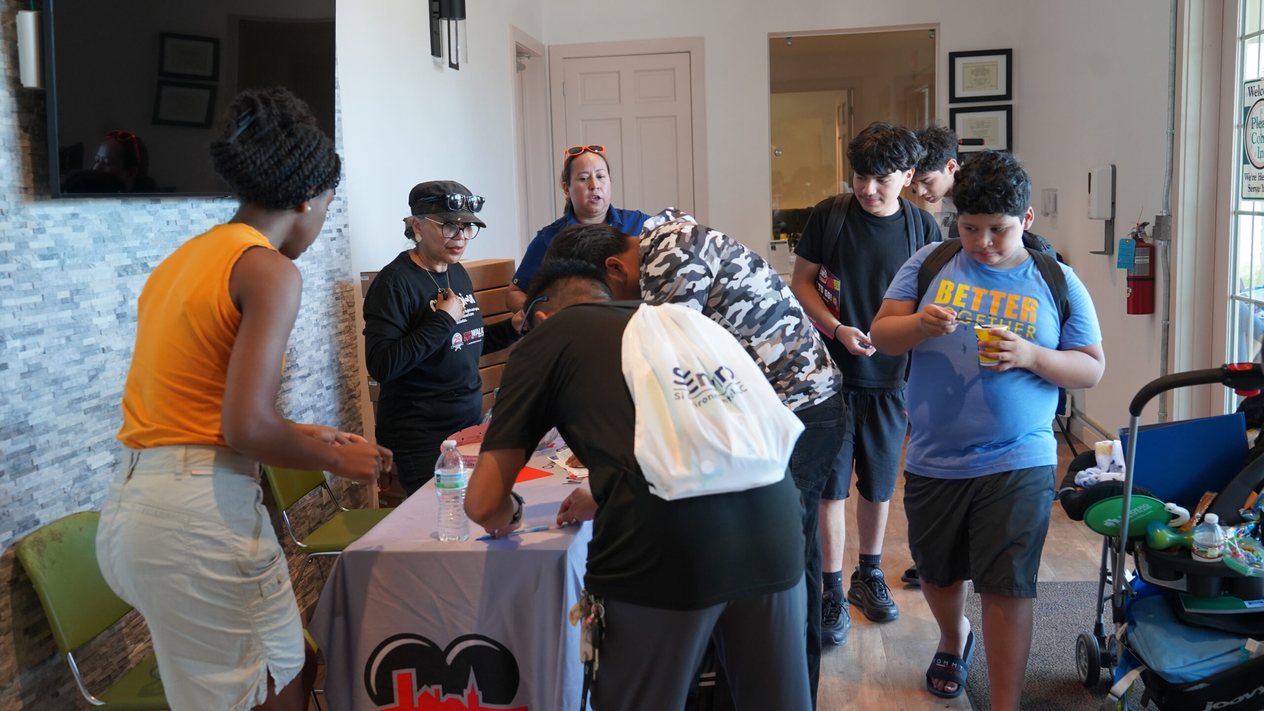 Families receiving technology support and resources at the C2H Back 2 School Bash